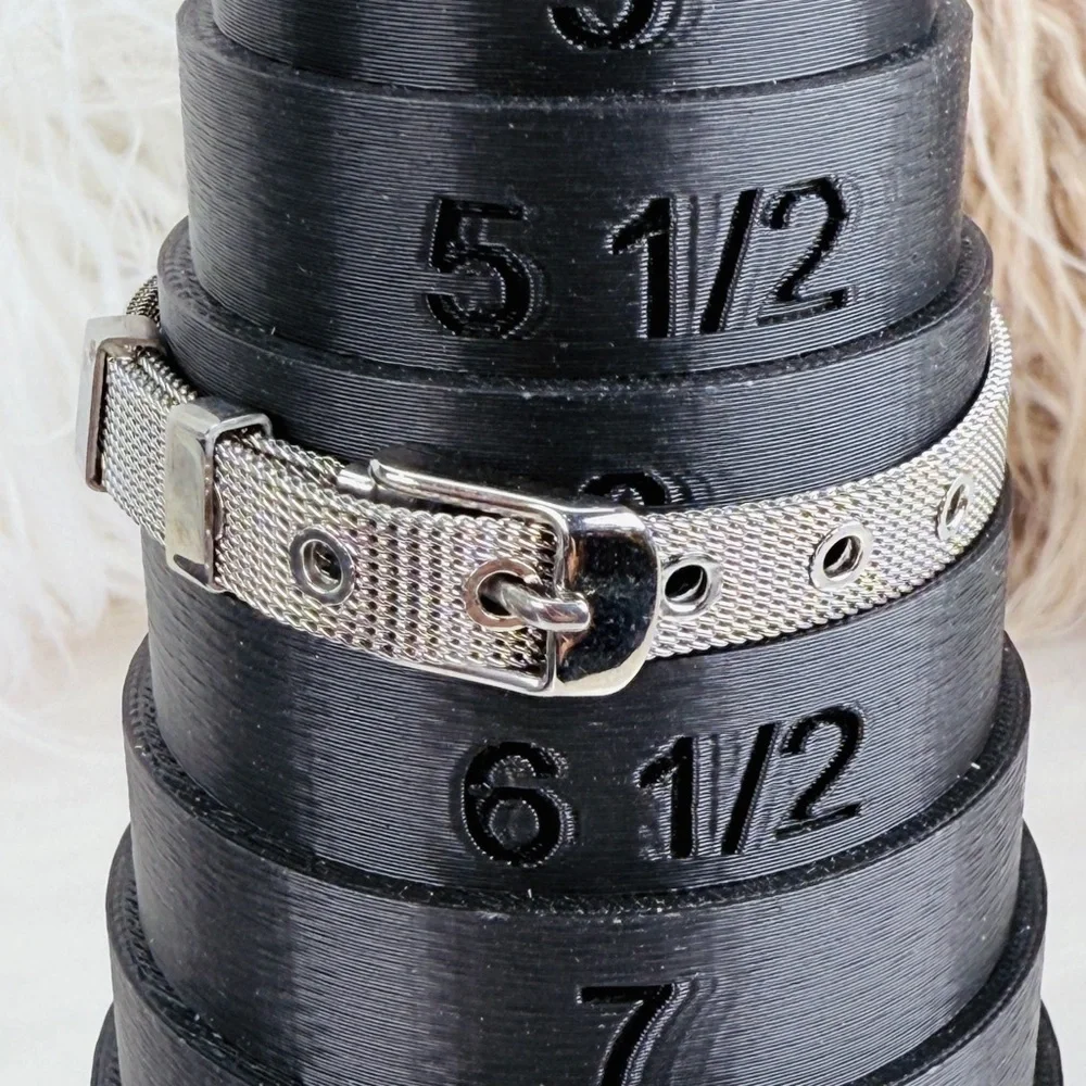 Silvertone Mesh Snap Bracelet with Blue Cross Design